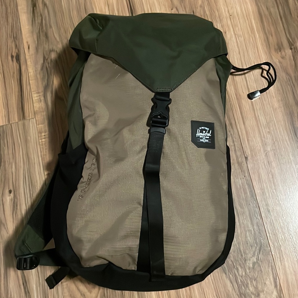 Green and tan Herschel backpack.